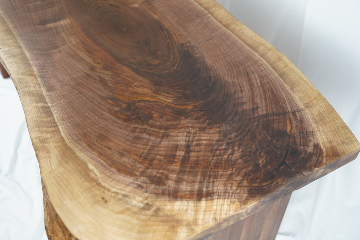 Close-up of highly figured walnut grain and natural live edge