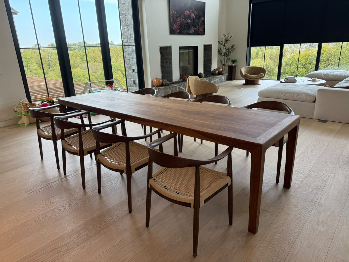 Custom solid walnut dining table by Garage Mills in a modern Toronto-area home