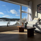 Garage Mills walnut live edge coffee table in a bright lake-view customer living room