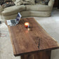 Handmade walnut live edge coffee table in a customer living room